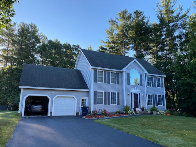 4 Sunblaze Dr, Nashua, NH 03062 - colonial house with an attached garage, asphalt driveway, and a front lawn
