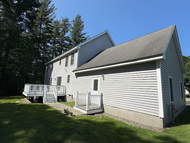 4 Sunblaze Dr, Nashua, NH 03062 - back of house with a yard, roof with shingles, and a wooden deck