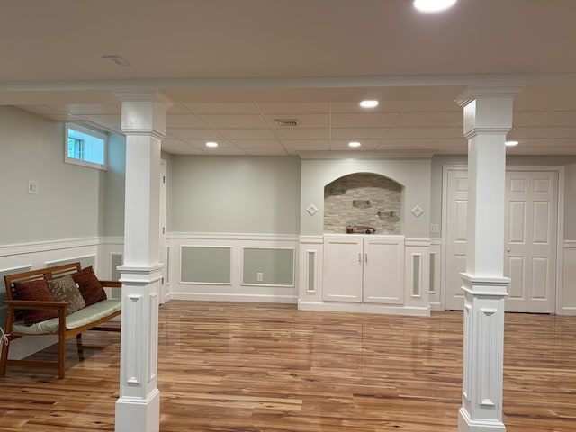 4 Sunblaze Dr, Nashua, NH 03062 - basement with light wood-style floors, wainscoting, recessed lighting, and a decorative wall