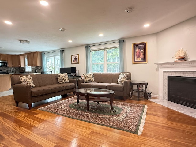 4 Sunblaze Dr, Nashua, NH 03062 - living room with plenty of natural light, light wood-type flooring, a fireplace, and recessed lighting