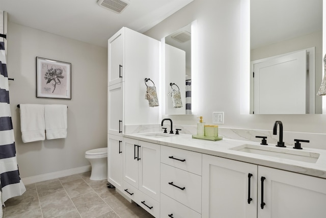 18 Artisan Dr Unit 419, Salem, NH 03079 - full bathroom with baseboards, double vanity, and toilet