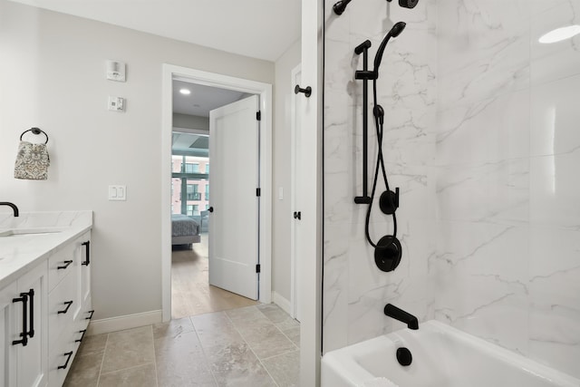 18 Artisan Dr Unit 419, Salem, NH 03079 - ensuite bathroom featuring vanity, tub / shower combination, and baseboards