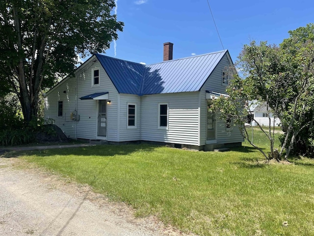 10 Deering Center Rd, Deering, NH 03244 - back of property with a chimney, a lawn, and metal roof