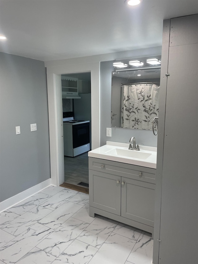 10 Deering Center Rd, Deering, NH 03244 - bathroom featuring vanity, marble finish flooring, recessed lighting, and baseboards