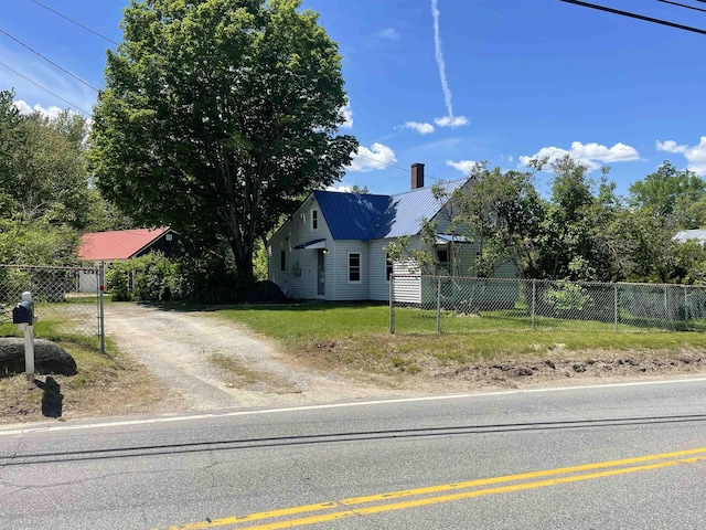 10 Deering Center Rd, Deering, NH 03244 - view of front of house with driveway, a chimney, and metal roof
