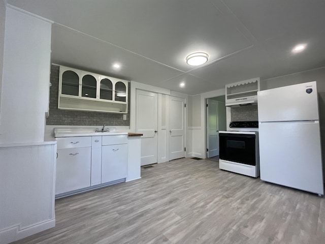 10 Deering Center Rd, Deering, NH 03244 - kitchen featuring freestanding refrigerator, electric range oven, under cabinet range hood, decorative backsplash, and light countertops