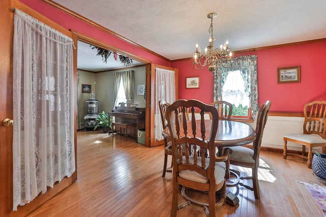 3 Elijah Hill Ln, Londonderry, NH 03053 - dining space featuring crown molding, wood-type flooring, and a chandelier