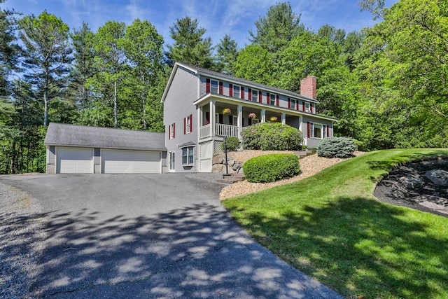 3 Elijah Hill Ln, Londonderry, NH 03053 - colonial home featuring a chimney, a front yard, covered porch, and a detached garage