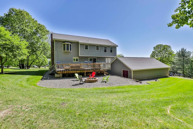 3 Elijah Hill Ln, Londonderry, NH 03053 - rear view of house with a deck, an outdoor fire pit, and a lawn
