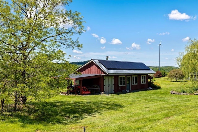 300 River Rd, Enosburg, VT 05450 - view of side of property featuring a lawn, an outbuilding, metal roof, and a pole building