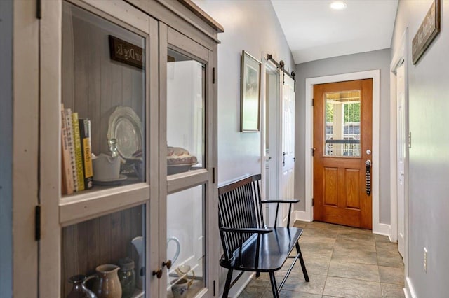 300 River Rd, Enosburg, VT 05450 - doorway with baseboards, stone finish floors, a barn door, french doors, and recessed lighting