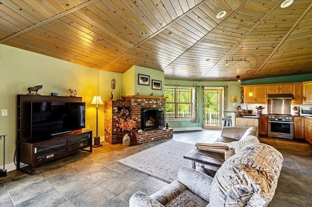 300 River Rd, Enosburg, VT 05450 - living area featuring wooden ceiling, baseboards, stone tile floors, lofted ceiling, and a brick fireplace