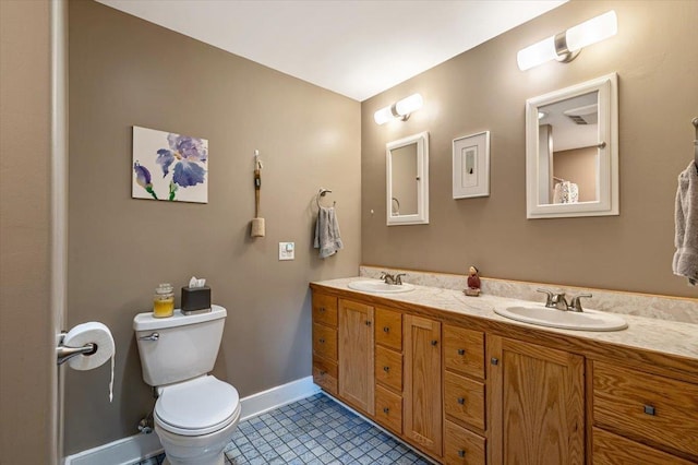 300 River Rd, Enosburg, VT 05450 - full bathroom with double vanity, toilet, tile patterned flooring, and baseboards