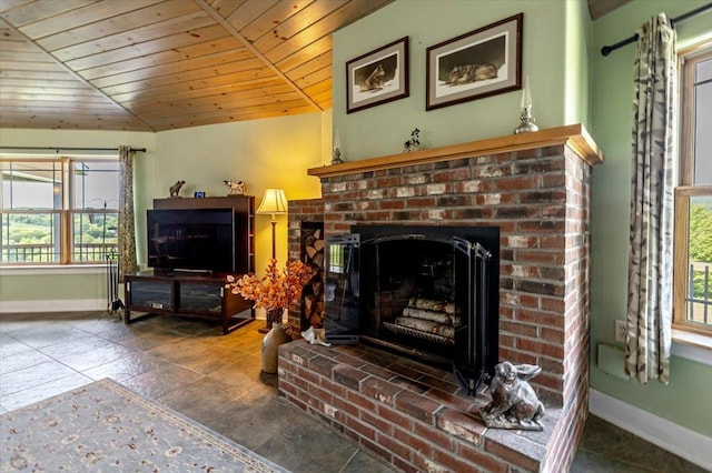 300 River Rd, Enosburg, VT 05450 - living area featuring wood ceiling, healthy amount of natural light, baseboards, a brick fireplace, and lofted ceiling