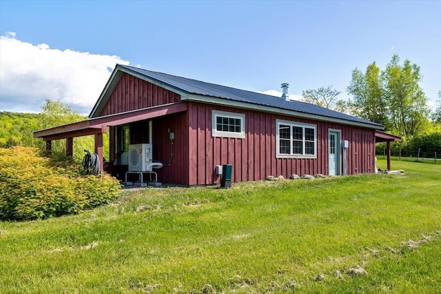 300 River Rd, Enosburg, VT 05450 - view of side of home featuring board and batten siding, ac unit, and a lawn