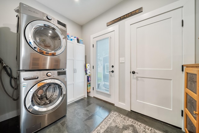 218 Manchester St, Nashua, NH 03064 - laundry room with cabinet space and stacked washer / drying machine