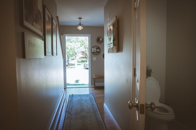 7 Plum St, Concord, NH 03301 - doorway featuring baseboards, baseboard heating, and dark wood-type flooring
