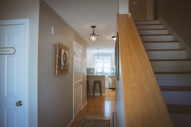 7 Plum St, Concord, NH 03301 - corridor with stairs and light wood-style floors