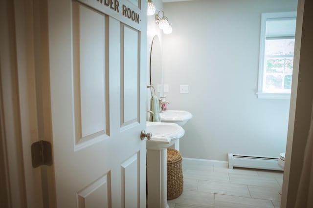 7 Plum St, Concord, NH 03301 - bathroom with a baseboard radiator, baseboards, and toilet