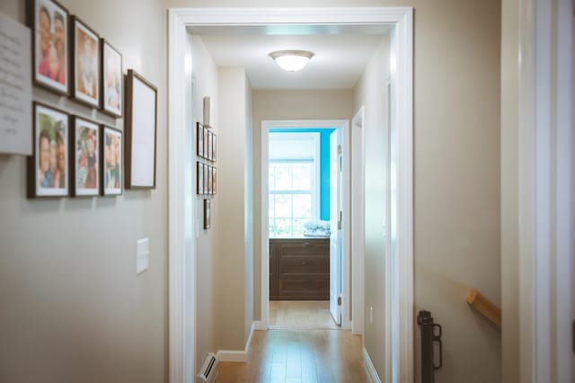 7 Plum St, Concord, NH 03301 - corridor with baseboard heating, light wood-style floors, and baseboards