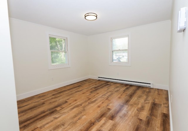 21 Hope Ave, Concord, NH 03301 - empty room with a baseboard radiator, wood finished floors, and baseboards