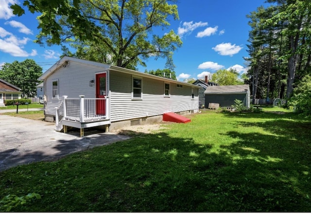 21 Hope Ave, Concord, NH 03301 - rear view of property featuring a yard and a wooden deck