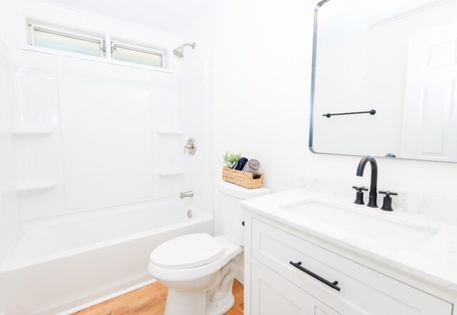 21 Hope Ave, Concord, NH 03301 - full bathroom featuring vanity, toilet,  shower combination, and wood finished floors
