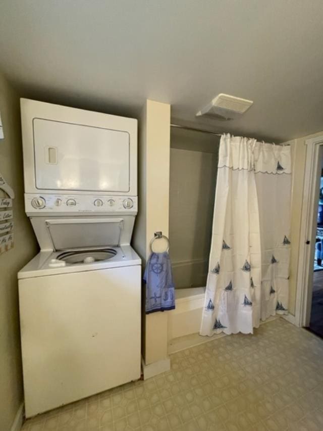 1295 Newark Pond Rd, Newark, VT 05871 - laundry room featuring stacked washer / drying machine and light flooring