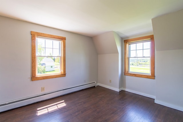 2147 Vt Route 111, Derby, VT 05829 - additional living space with a baseboard heating unit, dark wood-type flooring, baseboards, and lofted ceiling
