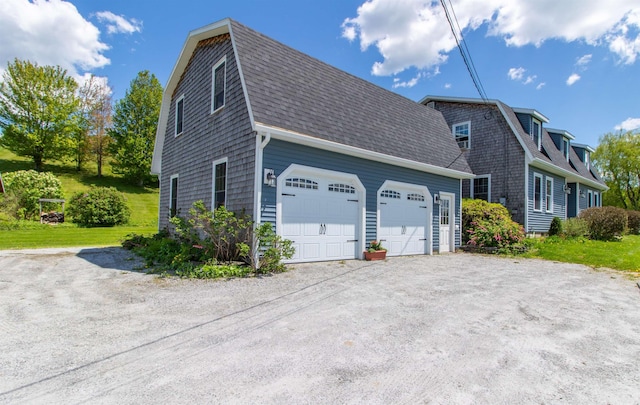2147 Vt Route 111, Derby, VT 05829 - view of side of property featuring a shingled roof, a gambrel roof, and dirt driveway