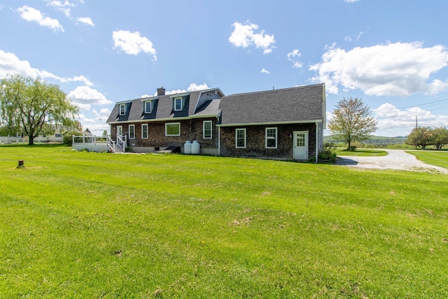 2147 Vt Route 111, Derby, VT 05829 - view of front facade featuring a front lawn, a chimney, and a shingled roof