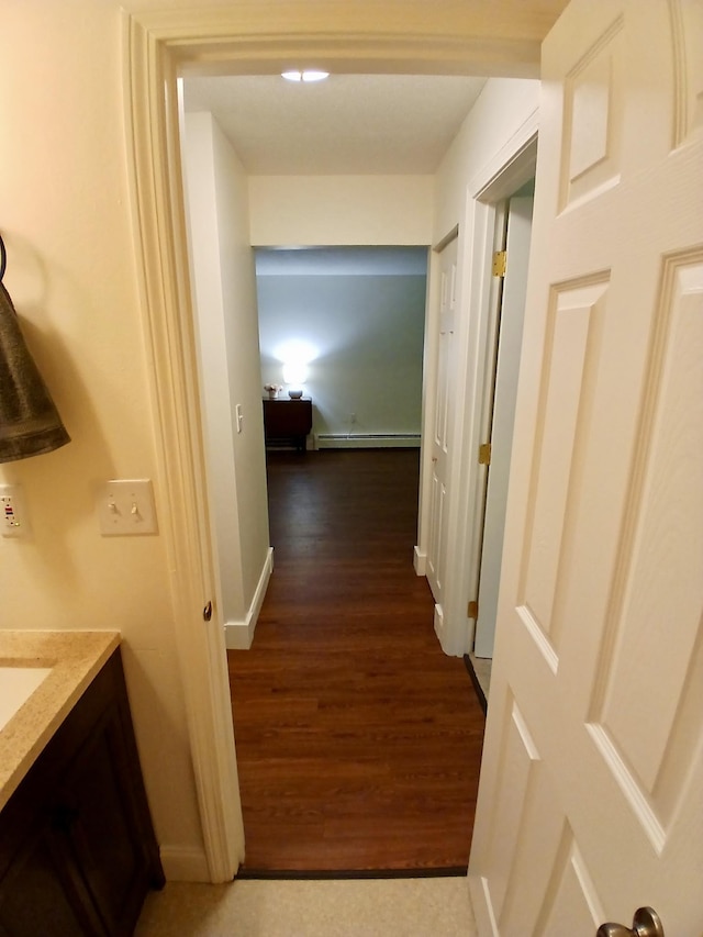 37 Alice Dr Unit 18, Concord, NH 03303 - hallway with baseboard heating, wood finished floors, and baseboards