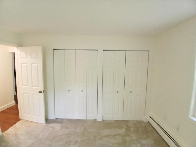 37 Alice Dr Unit 18, Concord, NH 03303 - unfurnished bedroom with baseboard heating, multiple closets, carpet, and baseboards