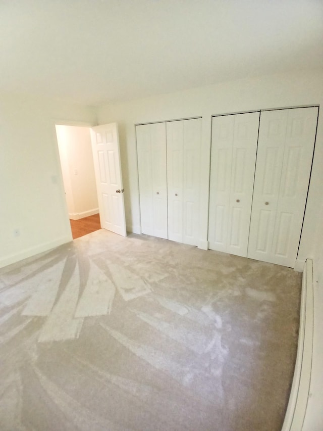 37 Alice Dr Unit 18, Concord, NH 03303 - unfurnished bedroom with two closets, carpet, and baseboards
