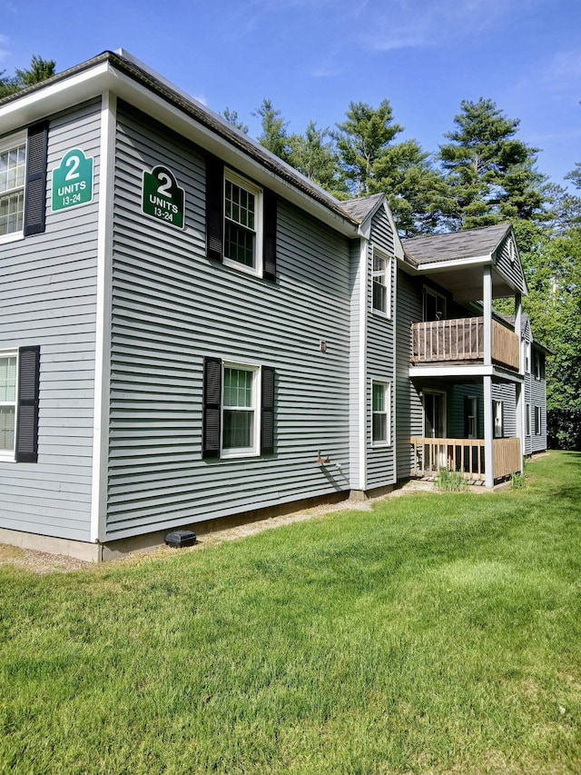 37 Alice Dr Unit 18, Concord, NH 03303 - rear view of property featuring a balcony and a lawn