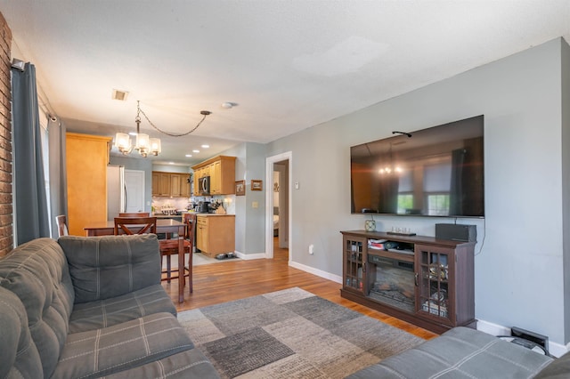 4 Palmer Ave, Plaistow, NH 03865 - living area featuring baseboards, a chandelier, light wood-type flooring, and recessed lighting