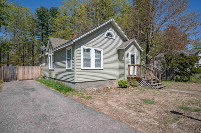 4 Palmer Ave, Plaistow, NH 03865 - view of front of house with roof with shingles and a chimney