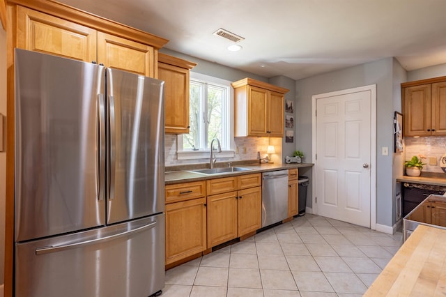 4 Palmer Ave, Plaistow, NH 03865 - kitchen with appliances with stainless steel finishes, a sink, light tile patterned flooring, tasteful backsplash, and recessed lighting