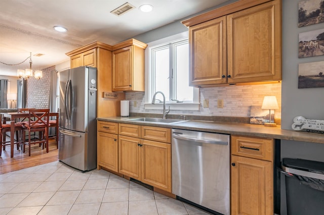 4 Palmer Ave, Plaistow, NH 03865 - kitchen featuring appliances with stainless steel finishes, a sink, a chandelier, dark countertops, and recessed lighting