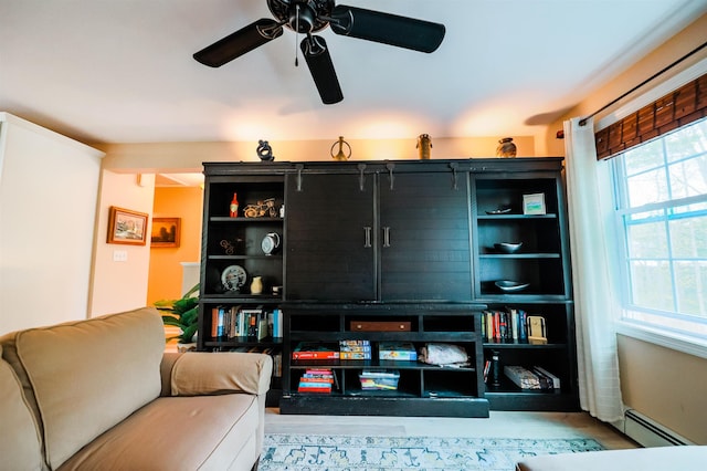 107 Artist Falls Rd, Conway, NH 03860 - living room featuring a baseboard heating unit, ceiling fan, and wood finished floors