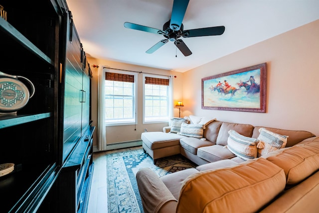 107 Artist Falls Rd, Conway, NH 03860 - living room featuring ceiling fan, a baseboard heating unit, and light wood-style flooring