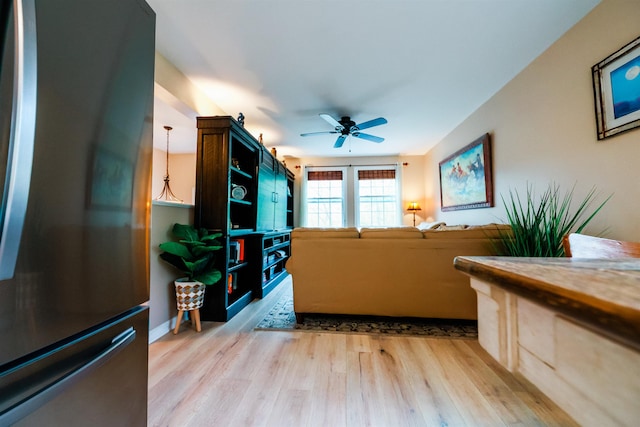 107 Artist Falls Rd, Conway, NH 03860 - living area with a ceiling fan and light wood-style floors