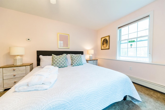 107 Artist Falls Rd, Conway, NH 03860 - carpeted bedroom with a baseboard heating unit