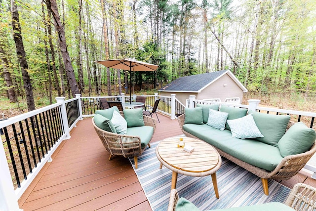 107 Artist Falls Rd, Conway, NH 03860 - wooden deck with an outdoor hangout area, an outbuilding, a wooded view, and outdoor dining area