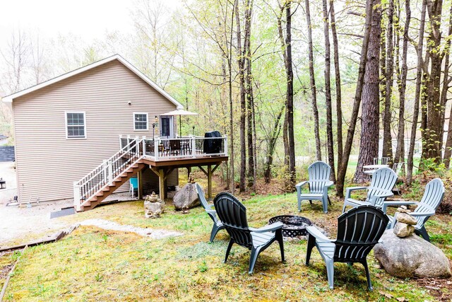 107 Artist Falls Rd, Conway, NH 03860 - rear view of property featuring a fire pit, stairs, and a deck