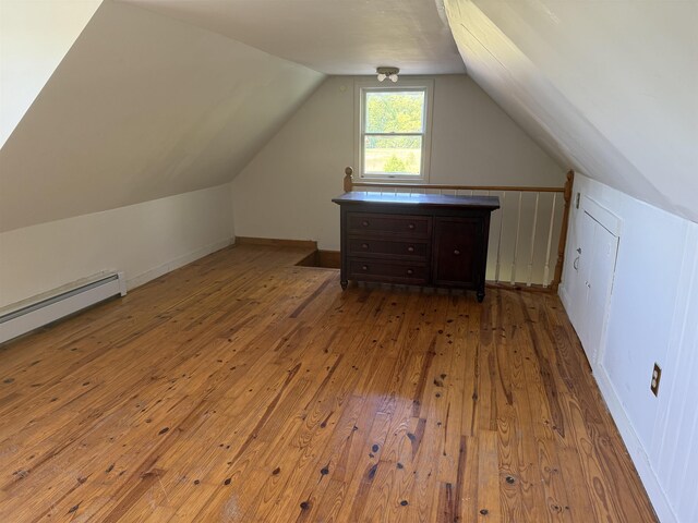 154B Main St, Kingston, NH 03848 - bonus room featuring hardwood / wood-style floors, vaulted ceiling, and a baseboard heating unit