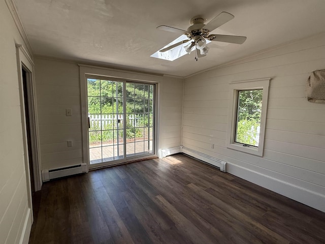 154B Main St, Kingston, NH 03848 - spare room with a baseboard heating unit, a baseboard radiator, dark wood-type flooring, a ceiling fan, and ornamental molding