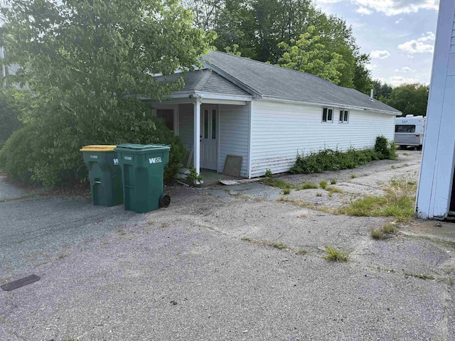 154B Main St, Kingston, NH 03848 - view of property exterior featuring a shingled roof