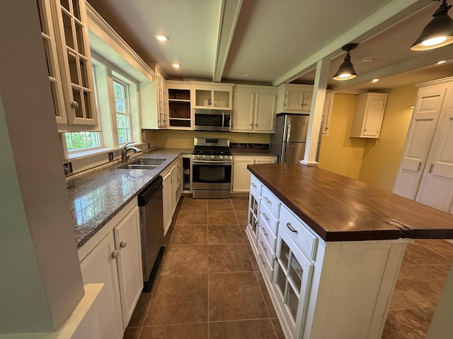 154B Main St, Kingston, NH 03848 - kitchen with stainless steel appliances, butcher block countertops, a sink, open shelves, and a kitchen island