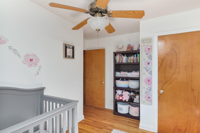 49 Morgan St, Burlington, VT 05408 - bedroom featuring light wood-style flooring, a nursery area, and a ceiling fan